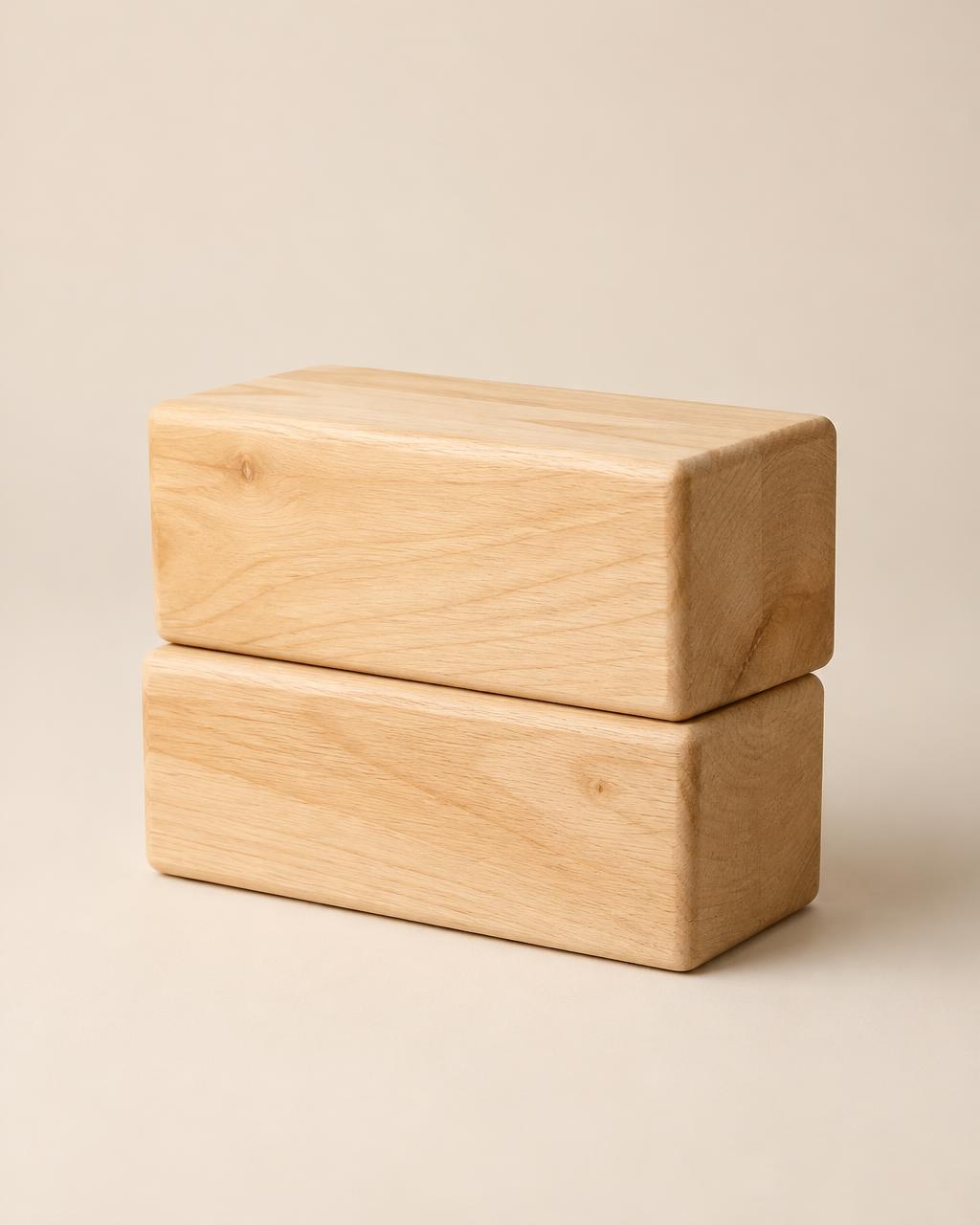 Pair of wooden yoga bricks, stacked